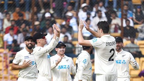New Zealand players celebrate the wicket of KL Rahul on in Bengaluru 