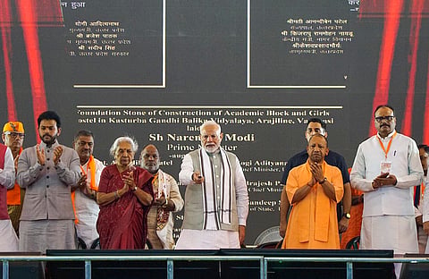 Prime Minister Narendra Modi, Uttar Pradesh Governor Anandiben Patel, Chief Minister Yogi Adityanath and others during the inauguration of various projects at the newly-constructed stadium at Sigra, in Varanasi.