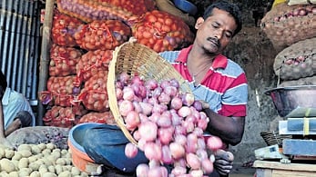 Onions and potatoes being sold at a market in Bhubaneswar 