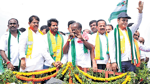NDA candidate from Channapatna, Nikhil Kumaraswamy, flanked by his father and Union Minister HD Kumaraswamy and 
BJP leaders Dr CN Ashwath Narayan, R Ashoka and DV Sadananda Gowda at a rally in Channapatna on Friday  