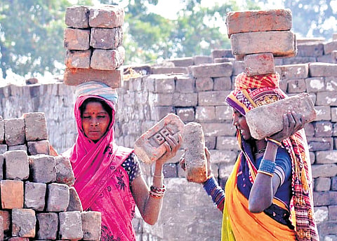 Women workers from Odisha are seen toiling in a brick kiln in Peddapalli district  