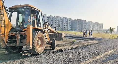 GMC officials remove unauthorised layouts at RTC Office Road on Sunday 