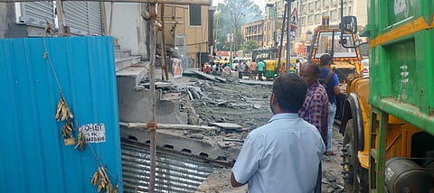 The corporation removing the unauthorised steps. 