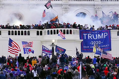  Rioters storm the West Front of the U.S. Capitol Jan. 6, 2021, in Washington. 