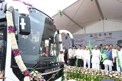 CM Siddaramaiah handed over Rs1 crore Accidnt Relief amount to dependents of KSRTC employees who died on duty or off duty and flagged off 20 Airvata Club class 2.0 buses in Bengaluru on Wednesday