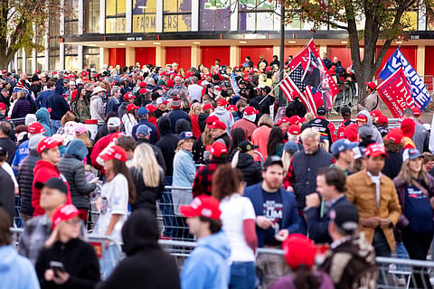 Supporters wait in line to enter a campaign rally for former US President and Republican presidential candidate Donald Trump in Raleigh, North Carolina on November 4, 2024. 