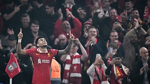 Liverpool's Colombian midfielder Luis Diaz celebrates after scoring his team fourth goal during the UEFA Champions League football match between Liverpool and Bayer Leverkusen on November 5, 2024. 