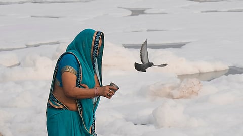 A devotee performs rituals on the bank of Yamuna at Kalindi Kunj on Wednesday 