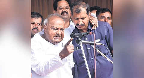 (Left) Former Prime Minister and JDS patriarch HD Deve Gowda makes an aggressive point at Makali village in Channapatna taluk on Wednesday; 