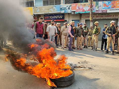 A tyre set on fire by agitators during a district-wide bandh called by Sanatan Dharam Sabha in protest against the killing of two Village Defence Guards by terrorists on Thursday, in Kishtwar district, Jammu & Kashmir, Friday, Nov. 8, 2024. 