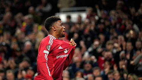 Manchester United's Amad Diallo celebrates after scoring his side's second goal during the Europa League opening phase soccer match between Manchester United and PAOK at the Old Trafford stadium in Manchester, England.