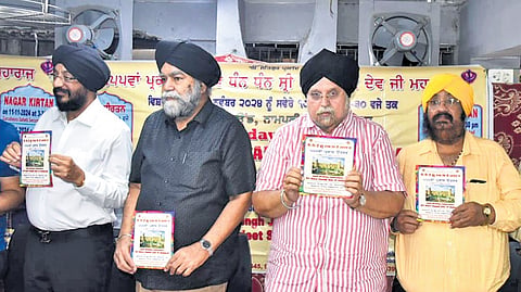 Prabhandak Committee members release a brochure on the occassion of 555th Prakash Utsav (birth anniversary) 
of Sri Guru Nanak Devji.
