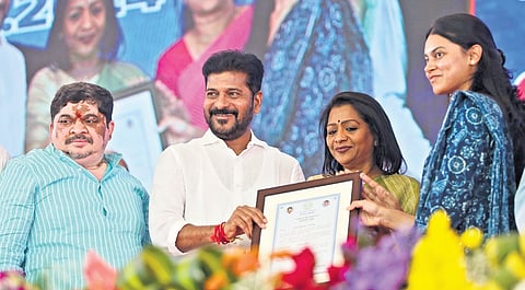 Chief Minister A Revanth Reddy hands over appointment letters to an AMVI at the Khairtabad RTA office on Monday 
