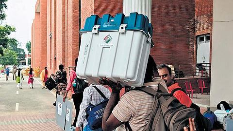 Staff deployed for election duty leave for their respective polling booths in Archakarahalli in Channapatna, Ramanagara district, on Tuesday. 
