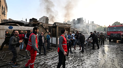 People check the damage following a reported Israeli strike in the Mazzeh district of Damascus on November 14, 2024.