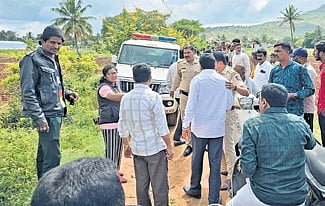 Police pacify the two groups at Thimmasandra village on Thursday