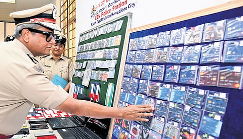 City Police Commissioner B Dayananda during the display of debit/credit cards and other items recovered by the CEN police, in Bengaluru on Friday 