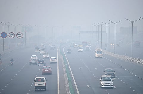 Vehicles ply on NH-24 during smog, in New Delhi, Saturday, Nov. 16, 2024. 