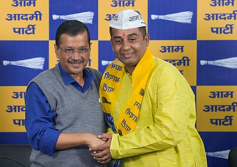 AAP National Convener Arvind Kejriwal with former BJP MLA Anil Jha after the latter joined the party, at the party office, in New Delhi, Sunday, Nov. 17, 2024. 