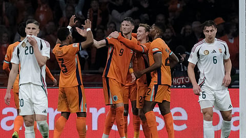 Cody Gakpo of the Netherlands celebrates with teammates after scoring his side's second goal during the UEFA Nations League soccer match between Netherlands and Hungary, at the Johan Cruyff Arena, in Amsterdam.