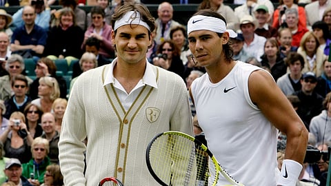 Switzerland's Roger Federer left, and Spain's Rafael Nadal pose for a photo prior to the start of the men's singles final on the Centre Court at Wimbledon