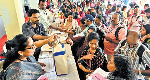 Electoral officers collecting polling materials at Government Victoria College in Palakkad on Tuesday