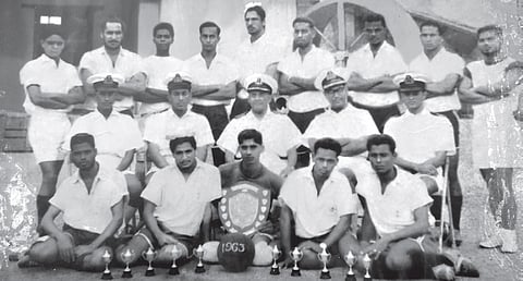 Jayan (standing third from right in the third row) with his colleagues and senior 
naval officials