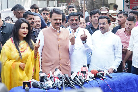  Maharashtra Deputy Chief Minister and BJP candidate Devendra Fadnavis and his family members and others show their fingers marked with indelible ink after casting votes during the Maharashtra Assembly elections, in Nagpur, Wednesday, Nov. 20, 2024. 