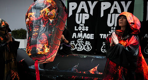 Activists participate in a demonstration for climate finance at the COP29 U.N. Climate Summit, Wednesday, Nov. 20, 2024, in Baku, Azerbaijan. 