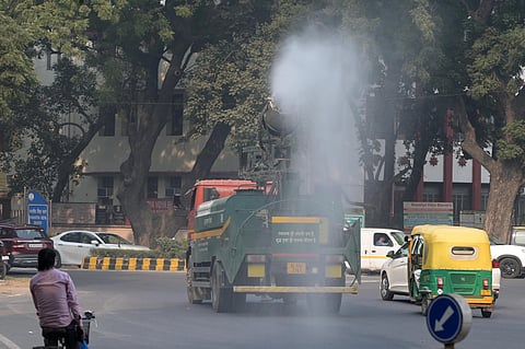 An anti-smog gun being used to spray water droplets to curb air pollution, in New Delhi on Friday.  