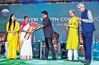 Environmentalist Jamuna Tudu (second from left) being given the lifetime achievement award at Dharitri Youth Conclave in Bhubaneswar on Sunday