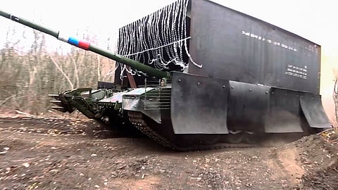 In this photo taken from video released by the Russian Defense Ministry Press Service on Tuesday, Nov. 26, 2024, a Russian T-80 tank rolls in Donetsk region in Ukraine. 