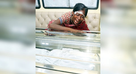 Ponnamma weeping after seeing mortal remains of her nephew Jeeva.