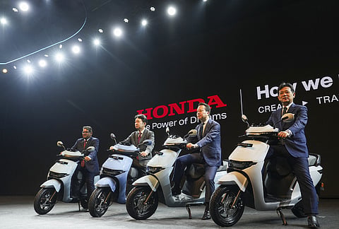 Bengaluru: From left- Yogesh Mathur, Director, Sales and Marketing, Honda Motorcycle & Scooter India, Tsutsumu Otani, CEO, President