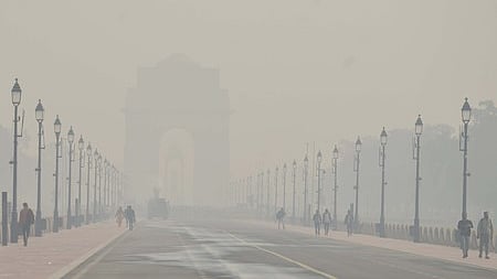 Commuters wade through dense smog in Delhi.