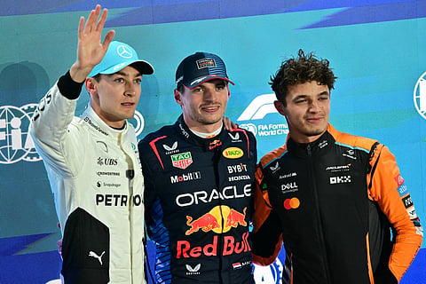 Mercedes' British driver George Russell (L) Red Bull Racing's Dutch driver Max Verstappen (C), and McLaren's British driver Lando Norris (R)