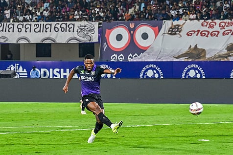 Diego MaurÃ­cio of Odisha FC strike the ball that becomes 4th goal against Bengaluru FC at Kalinga Stadium in Bhubaneswar
