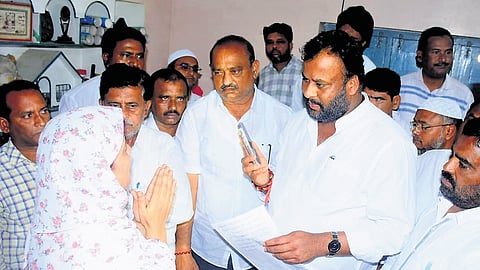 Transport Minister Mandipalli Ramprasad Reddy consoles the family members of deceased Mathematics teacher CA Ajias Ahmed in Kadapa on Friday 
