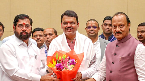 Maharashtra Chief Minister Devendra Fadnavis being felicitated by Deputy CMs Eknath Shinde and Ajit Pawar at the Cabinet meeting, in Mumbai, Thursday, Dec. 5, 2024.