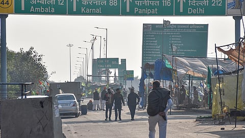 Farmers at the protest site at Shambhu Border before the start of their march towards Delhi, in Patiala district, Sunday, Dec. 8, 2024. 