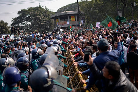 Supporters of Bangladesh's former Prime Minister Khaleda Zia and her Bangladesh Nationalist Party (BNP) are stopped by the police outside the Indian High Commission in Dhaka, Bangladesh during an anti-India protest Sunday, Dec. 8, 2024.