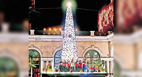 Standing 35 feet tall without calculating the base height, the tree was strung with LED white lights from top to bottom, tinsel, white ornaments, glass baubles, and many more. 