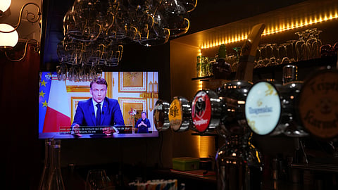 French President Emmanuel Macron addresses the nation following the resignation of ousted Prime Minister Michel Barnier, a day after a historic no-confidence vote at the National Assembly left France without a functioning government. Thursday, Dec. 5, 2024 in Versailles, outside Paris.