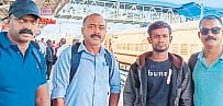 Police officers with Shahin Molla (in jacket)