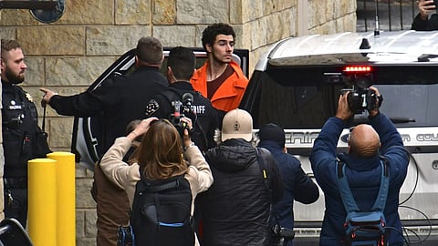 Suspect Luigi Mangione is taken into the Blair County Courthouse on Tuesday, Dec 10, 2024, in Hollidaysburg, Pa.