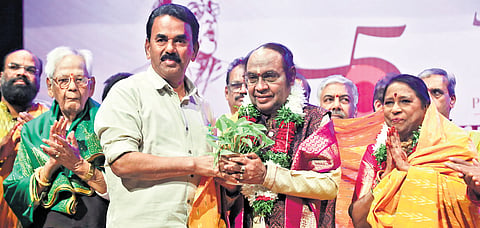 Minister Jupally Krishna Rao honours Yella Venkateshwara Rao in Hyderabad on Sunday. 