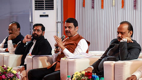 Maharashtra Chief Minister Devendra Fadnavis addresses a press conference ahead of the swearing-in ceremony of the ministers of the Mahayuti alliance government in Nagpur on Sunday. Deputy Chief Ministers Eknath Shinde and Ajit Pawar are also present.