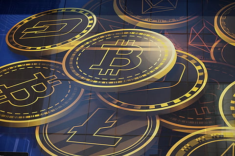 An advertisement of Bitcoin, one of the cryptocurrencies, is displayed on a building in Hong Kong, on Nov 18, 2021.