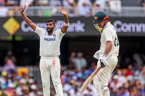 India's Jasprit Bumrah, left, appeals unsuccessfully for the wicket of Australia's Travis Head during play on day two of the third cricket test between India and Australia at the Gabba in Brisbane, Australia, Sunday, Dec.15, 2024.