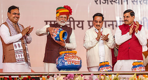 Prime Minister Narendra Modi with Union Minister of Jal Shakti C R Patil, Rajasthan Chief Minister Bhajanlal Sharma, and Madhya Pradesh Chief Minister Mohan Yadav during the 'Ek Varsh-Parinaam Utkarsh' event, marking the completion of one year of Rajasthan government, in Jaipur, Tuesday, Dec. 17, 2024. 